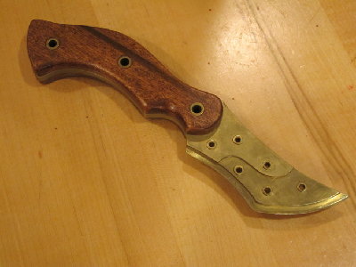 Brass layered design. 18gauge brass w/poplar scales, treated stained and polyurethane. Blade is 3.5&amp;quot;