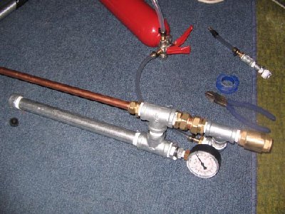 Fire extinguisher cannon assembly.