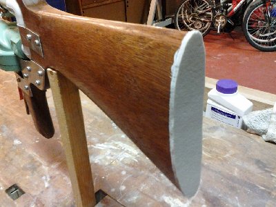 I just glued a thin piece of foam to the end of the stock to act as a bit of padding