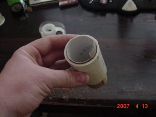 This is were your pipe comes in.Take the TP role and put it inside the pipe.Size the roll to fit the pipe on ONE side then tape it on that end.On the other size sqeeze it to fit the bottom of the cup and tape it.This side will be smaller