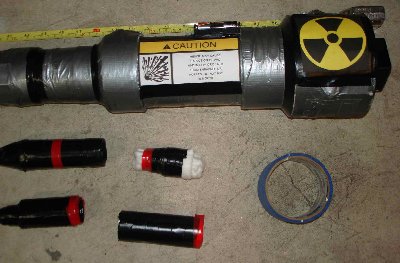 Here you can see a close-up of the chamber and ammo. Clockwise from left, you can see the &amp;quot;explosive&amp;quot; round, its cap filled with POP-ITS (its cut off a bit). Next, the &amp;quot;incendiary&amp;quot; q-tip round, which is sprayed with fuel, and catches on fire. It can also be used as a tracer. Third, you can see the &amp;quot;frag/flac/shotgun&amp;quot; round, used to fire airsoft bbs or anything that will fit. Lastly, the &amp;quot;armor piercing&amp;quot; round,  which is... dangerous. Its cut off, click the image below this one for the full view. Also shown is the burst disk tape. Also, note the quotations - the &amp;quot;incendiary&amp;quot; is verry unlikely to start a fire, or keep alight for its whole flight, and the &amp;quot;explosive&amp;quot; round just makes a flash and fireworks sound. The &amp;quot;armor peircing&amp;quot; round however, does its job well.