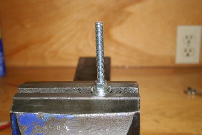 Assemble your mandrel as shown. Large washer on the bottom, filed down washer on top. Secure with nuts top and bottom. The bottom face of the filed down washer should be 5/8&amp;quot; from the end of the all thread.